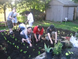 Me with fellow solutionaries planting a new community garden during Summer of Solutions 2009 - Worcester